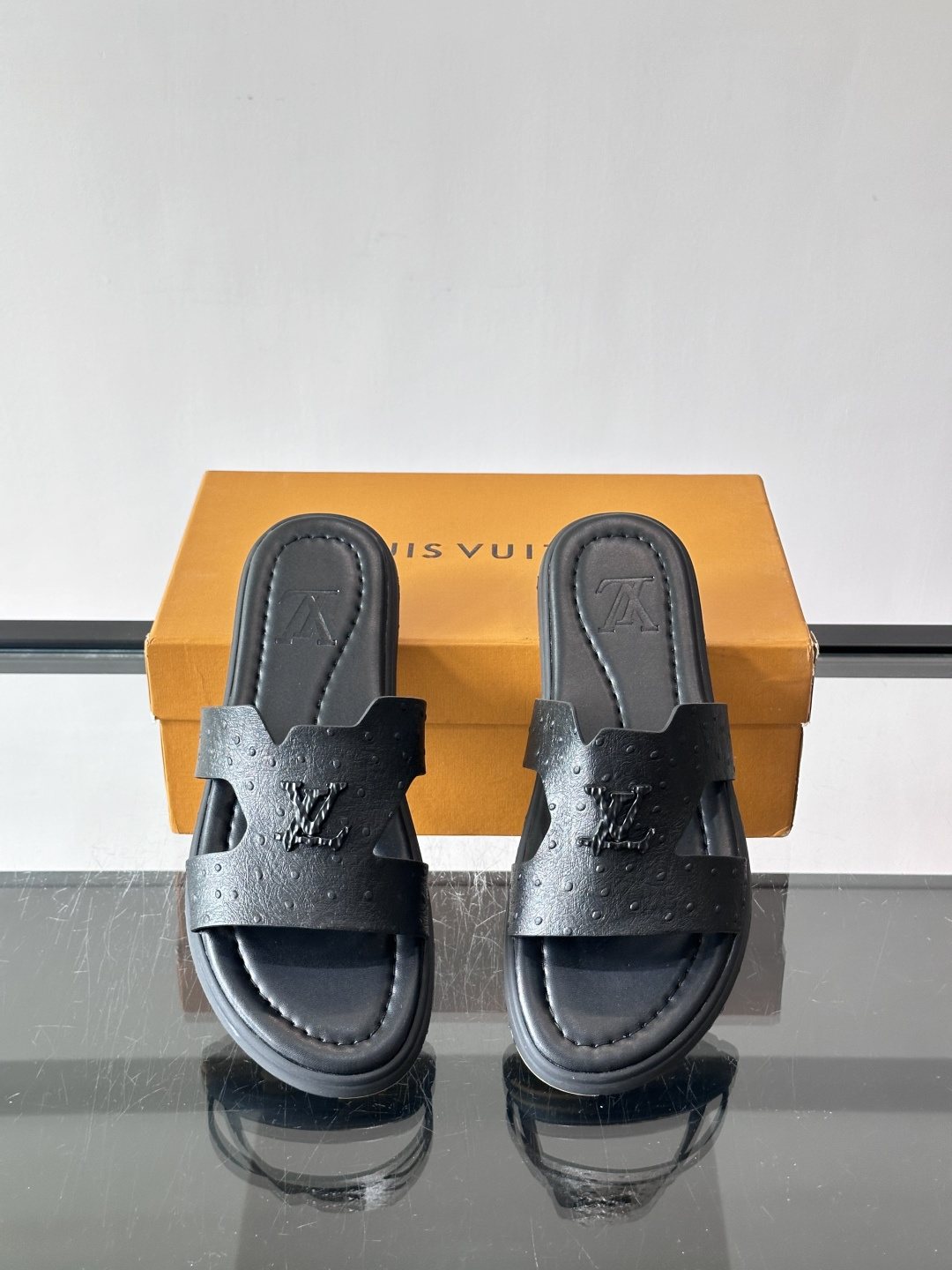 Louis Vuitton Black Embossed Slide Sandals — front