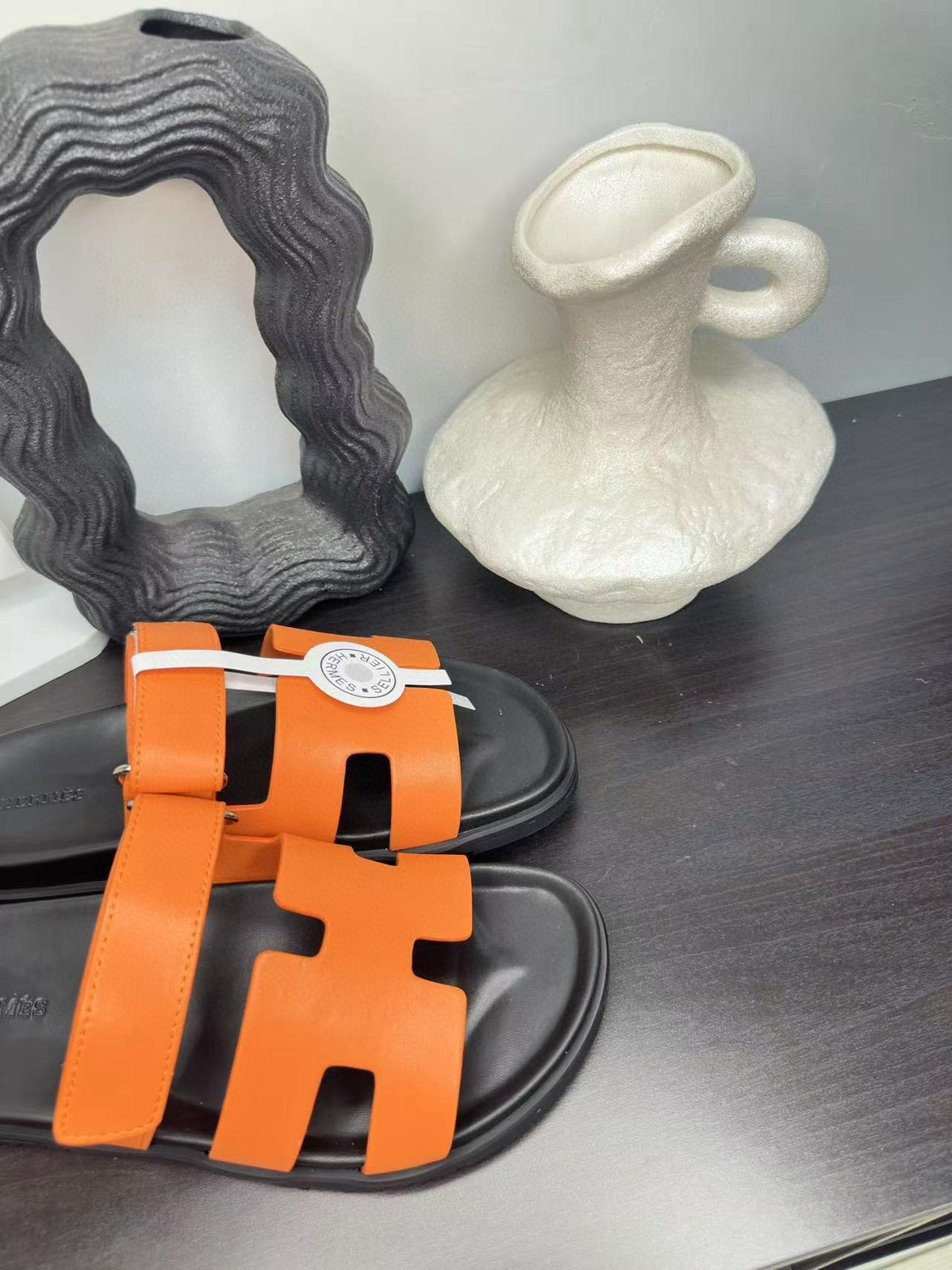Hermès Orange Interwoven Slide Sandals — front
