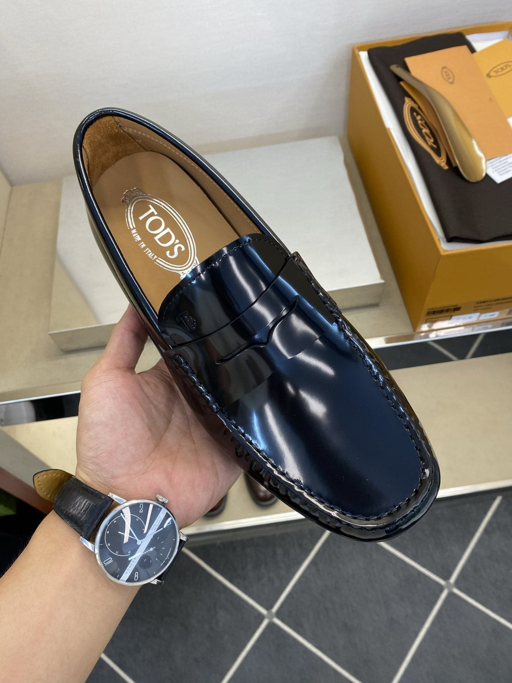 Tod's Glossy Dark Navy Penny Loafers — model