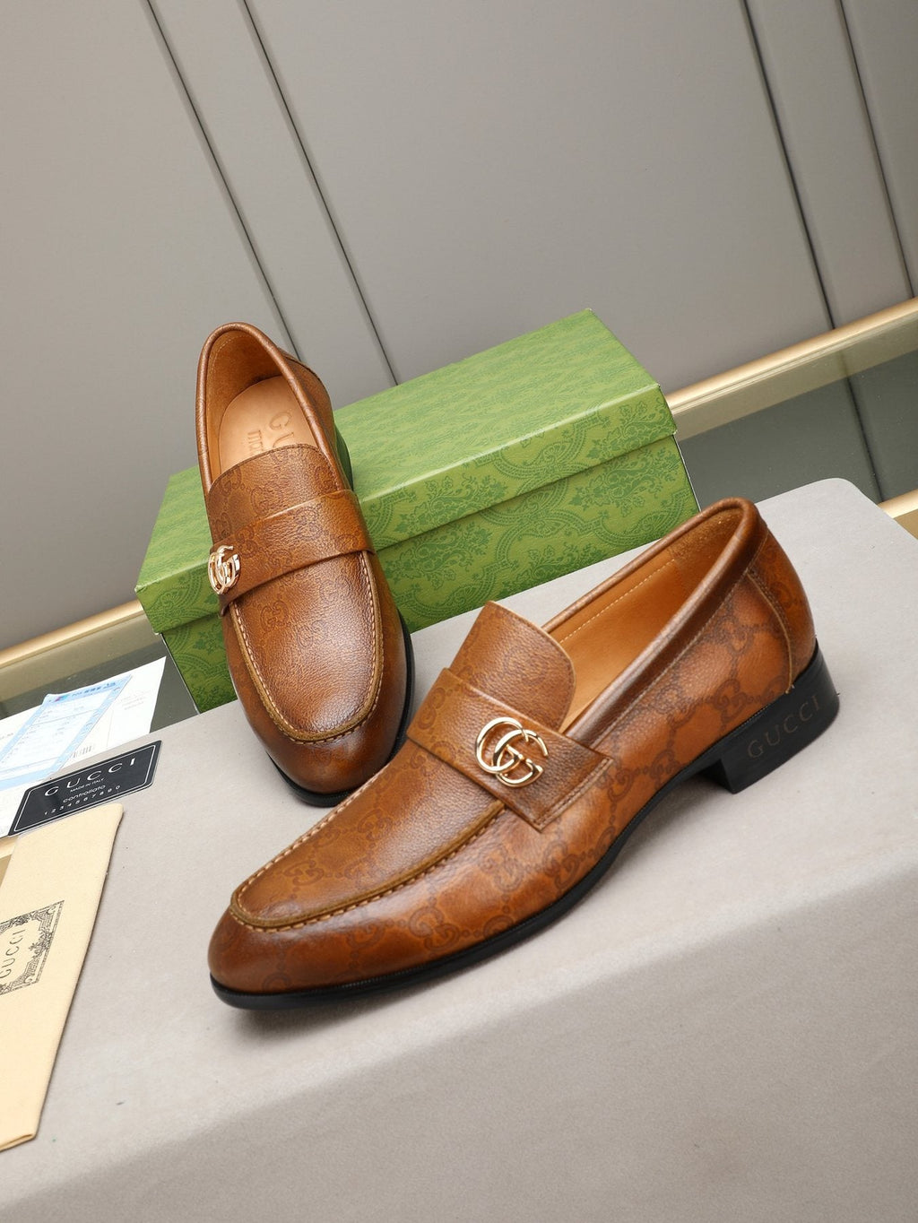 Gucci Brown Monogram Hardware Loafers — front